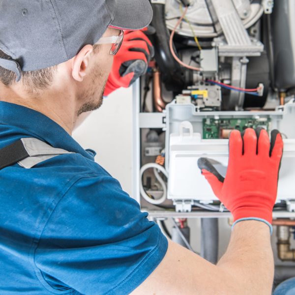 Heating,Central,Gas,Furnace,Issue.,Technician,Trying,To,Fix,The